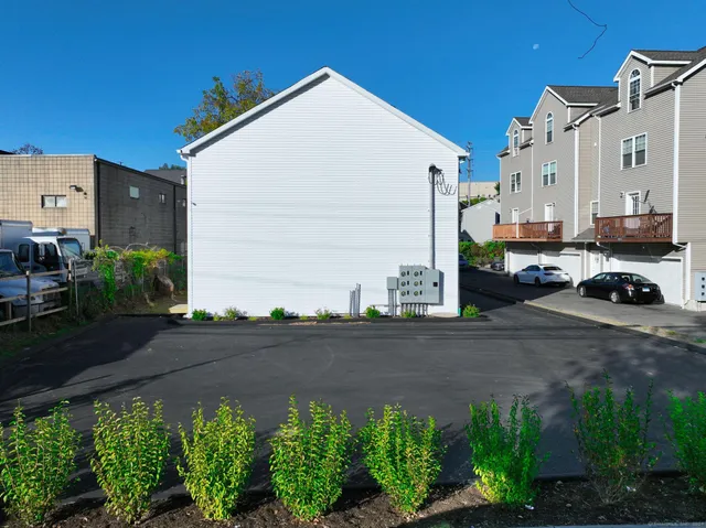 a view of street with parked cars