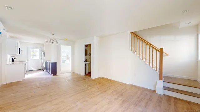 a kitchen with stainless steel appliances granite countertop white cabinets and a stove