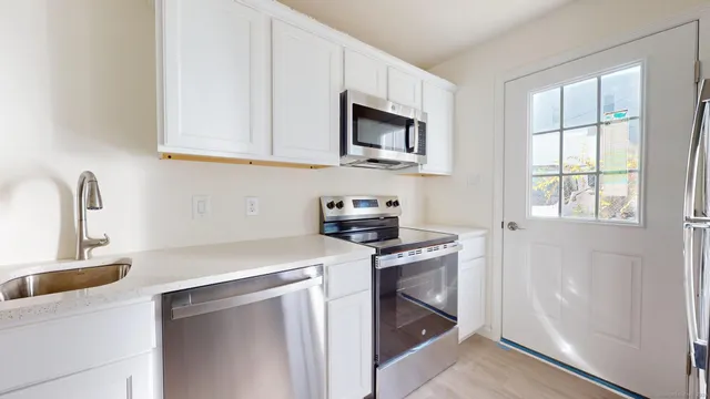 a view of a kitchen with a sink