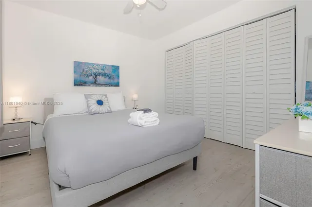 a bedroom with a bed and a table