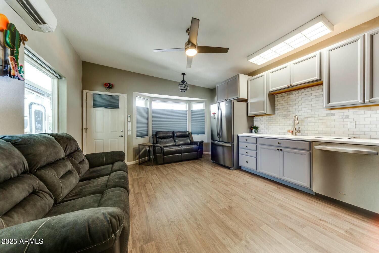 17200 West Bell Road, Unit 903 Surprise, AZ 85374 - Photo 12 of 21 a living room with furniture and a kitchen