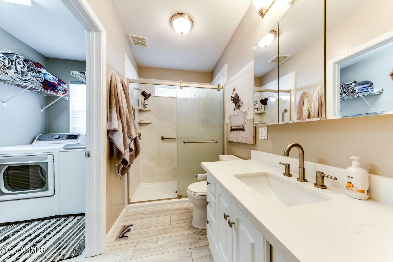 17200 West Bell Road, Unit 903 Surprise, AZ 85374 - Photo 16 of 21 a bathroom with a sink toilet and shower