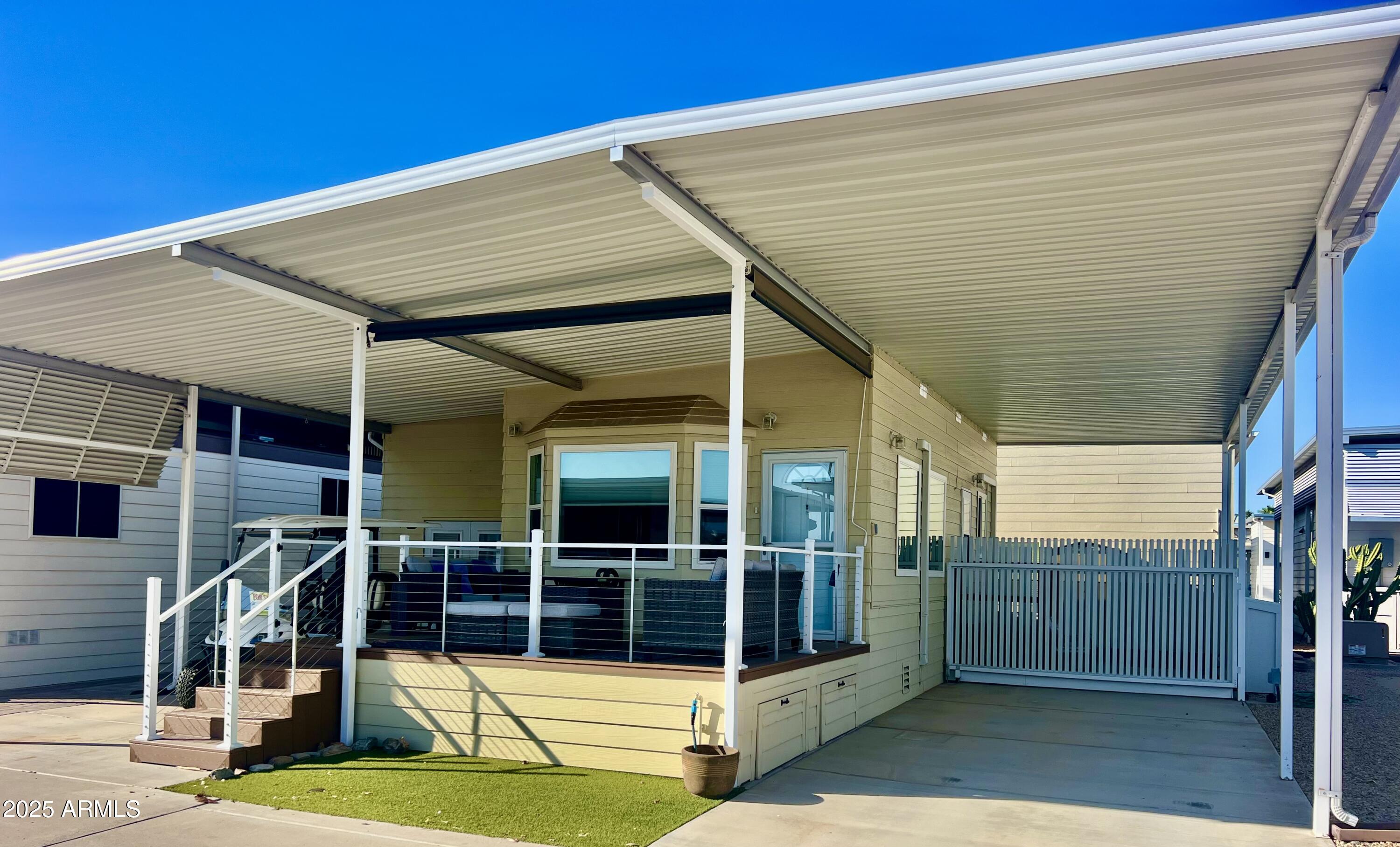 17200 West Bell Road, Unit 903 Surprise, AZ 85374 - Photo 21 of 21 a view of a patio with table and chairs