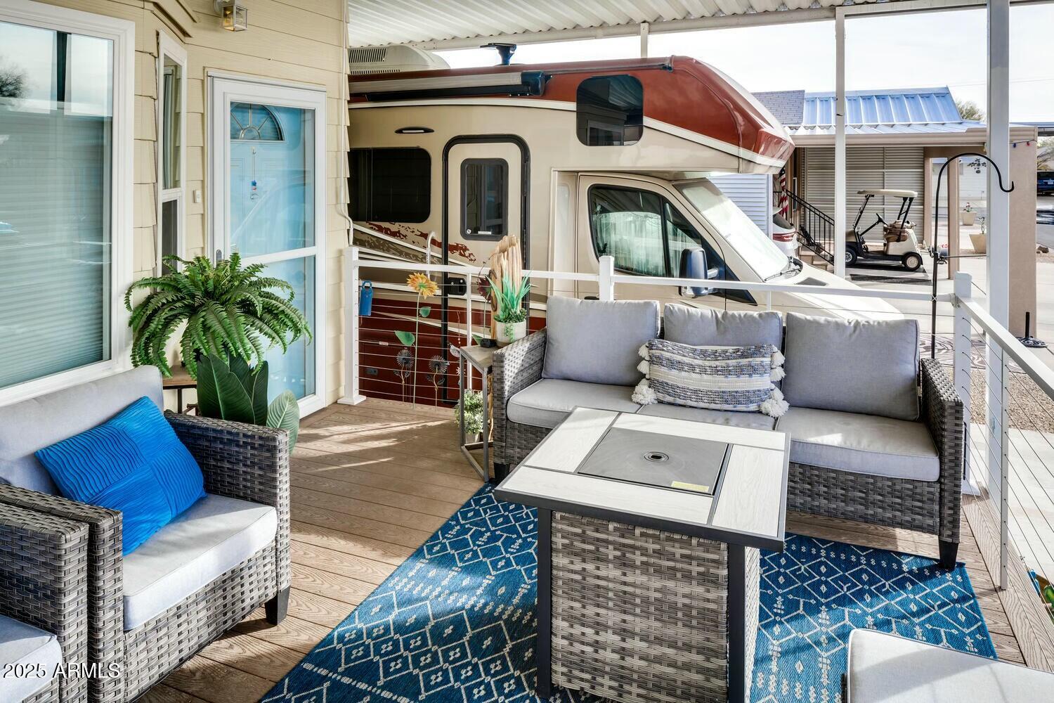 17200 West Bell Road, Unit 903 Surprise, AZ 85374 - Photo 3 of 21 a living room with furniture and a fireplace