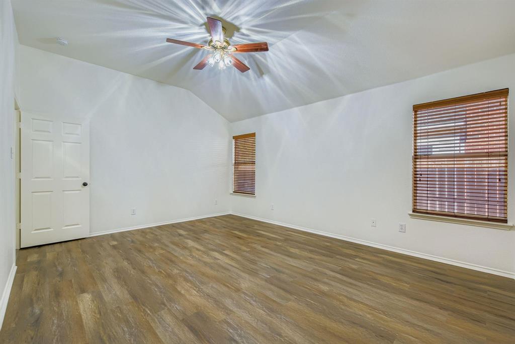 12407 Hawk Creek Drive Frisco, TX 75033 - Photo 18 of 33 wooden floor in an empty room with a window