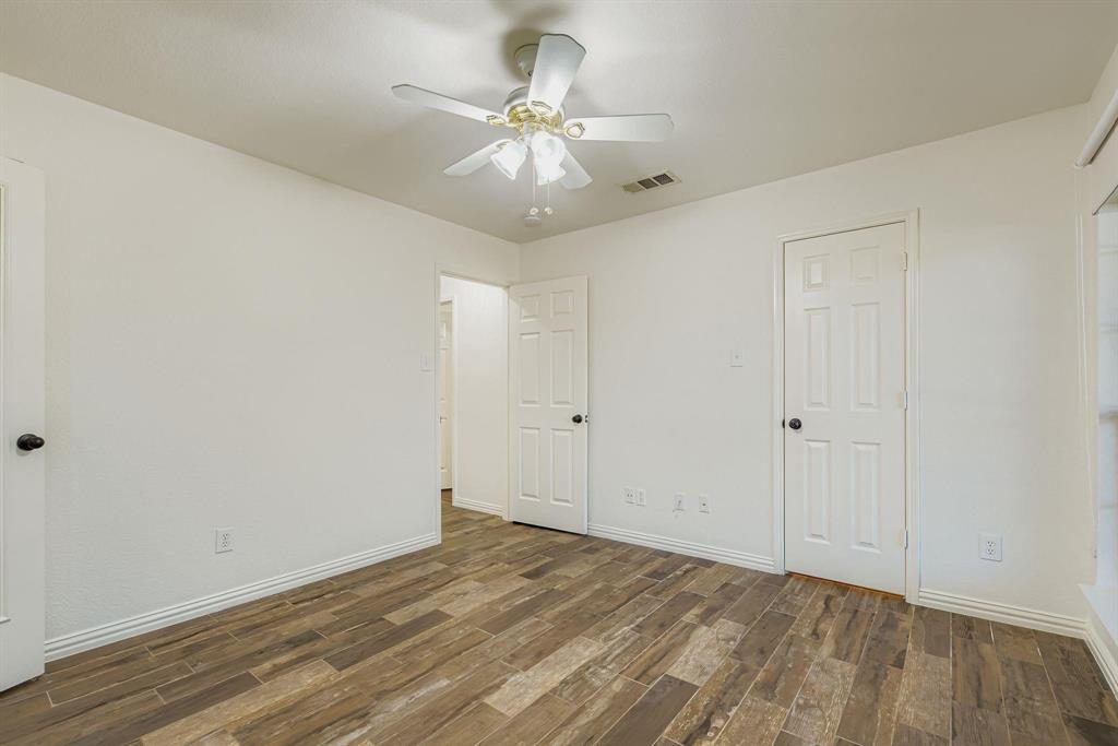 12407 Hawk Creek Drive Frisco, TX 75033 - Photo 7 of 33 wooden floor in an empty room