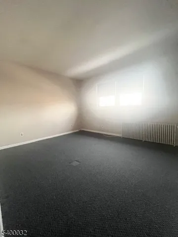 a view of room and hall with a window