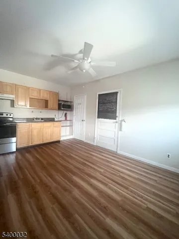 a view of a kitchen with a sink and a stove