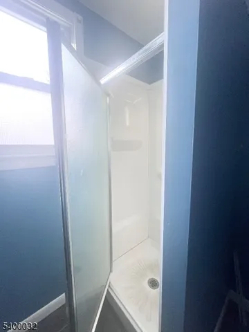 a view of a kitchen from the hallway