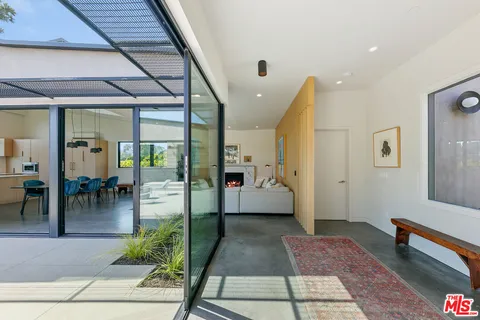 a lobby with furniture and a rug