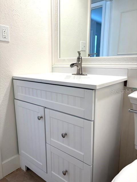 1901 Andover Way, Unit 38 Sun City Center, FL 33573 - Photo 17 of 33 a bathroom with a sink and a mirror