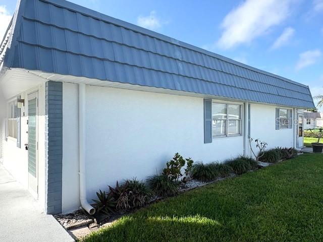 1901 Andover Way, Unit 38 Sun City Center, FL 33573 - Photo 2 of 33 a view of a backyard with plants