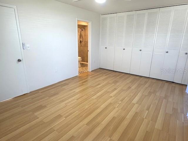 1901 Andover Way, Unit 38 Sun City Center, FL 33573 - Photo 22 of 33 a view of an empty room with wooden floor