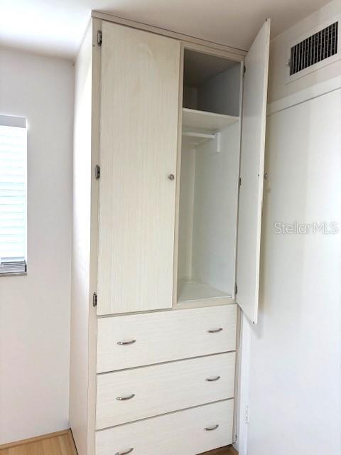 1901 Andover Way, Unit 38 Sun City Center, FL 33573 - Photo 25 of 33 a view of a dresser
