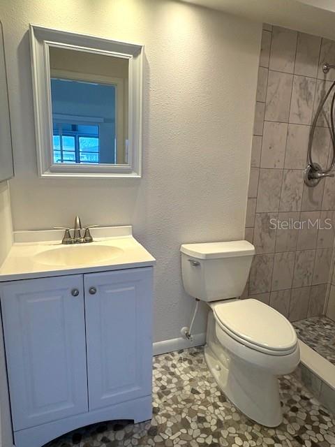 1901 Andover Way, Unit 38 Sun City Center, FL 33573 - Photo 27 of 33 a bathroom with a sink toilet and vanity