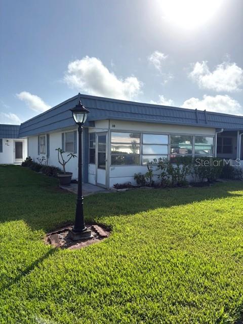 1901 Andover Way, Unit 38 Sun City Center, FL 33573 - Photo 31 of 33 a front view of a house with garden