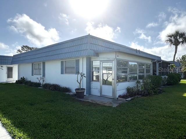 1901 Andover Way, Unit 38 Sun City Center, FL 33573 - Photo 33 of 33 a view of a house with backyard and garden