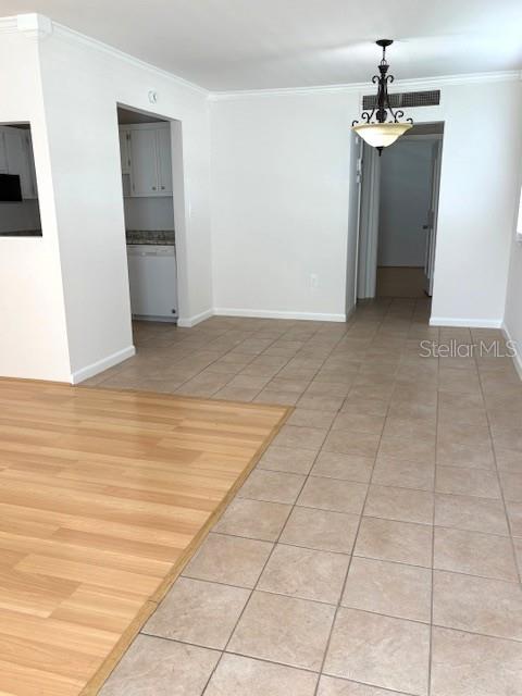 1901 Andover Way, Unit 38 Sun City Center, FL 33573 - Photo 8 of 33 a view of an empty room with a chandelier