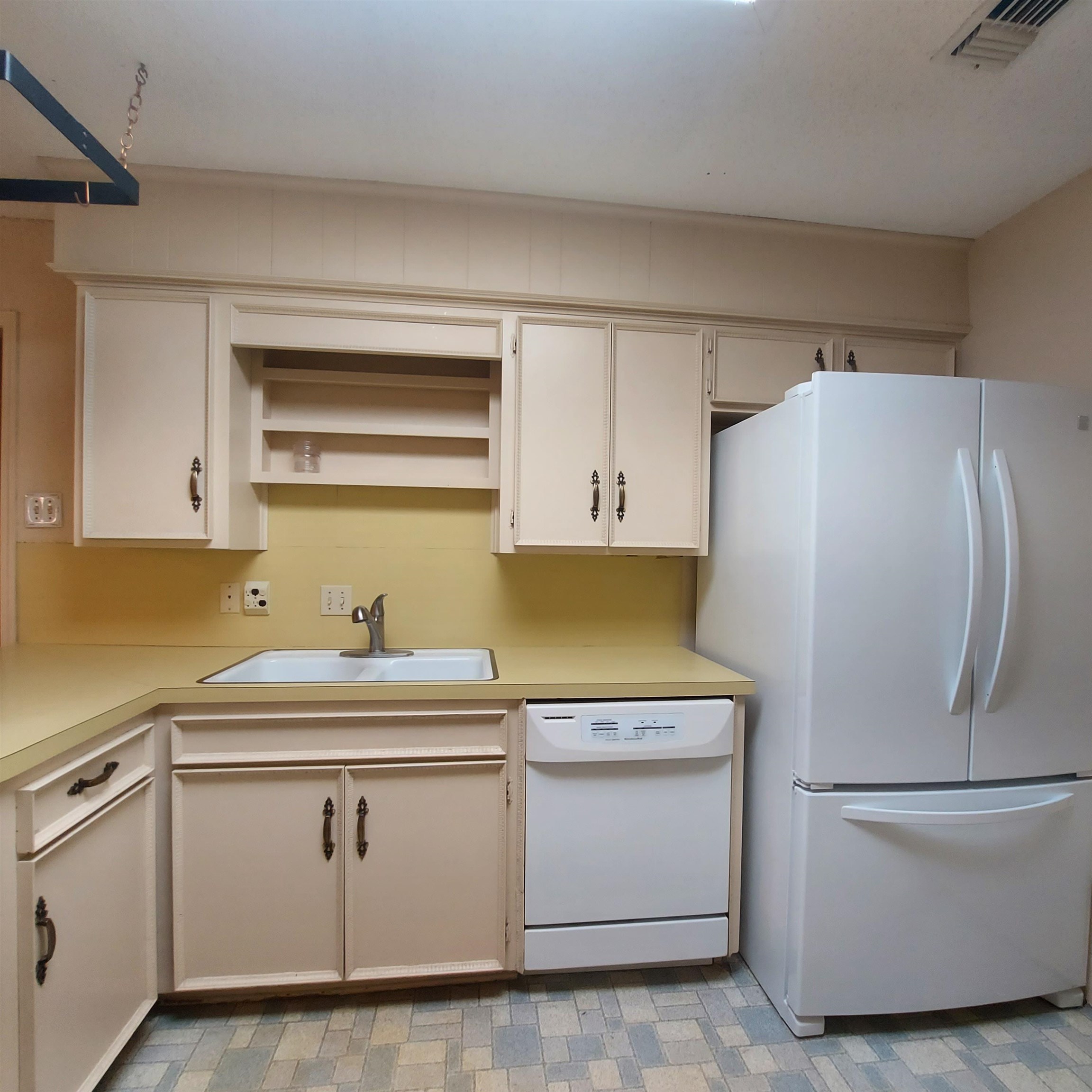151 Riverside Drive Kingsland, TX 78639 - Photo 5 of 14 a white refrigerator freezer sitting inside of a kitchen
