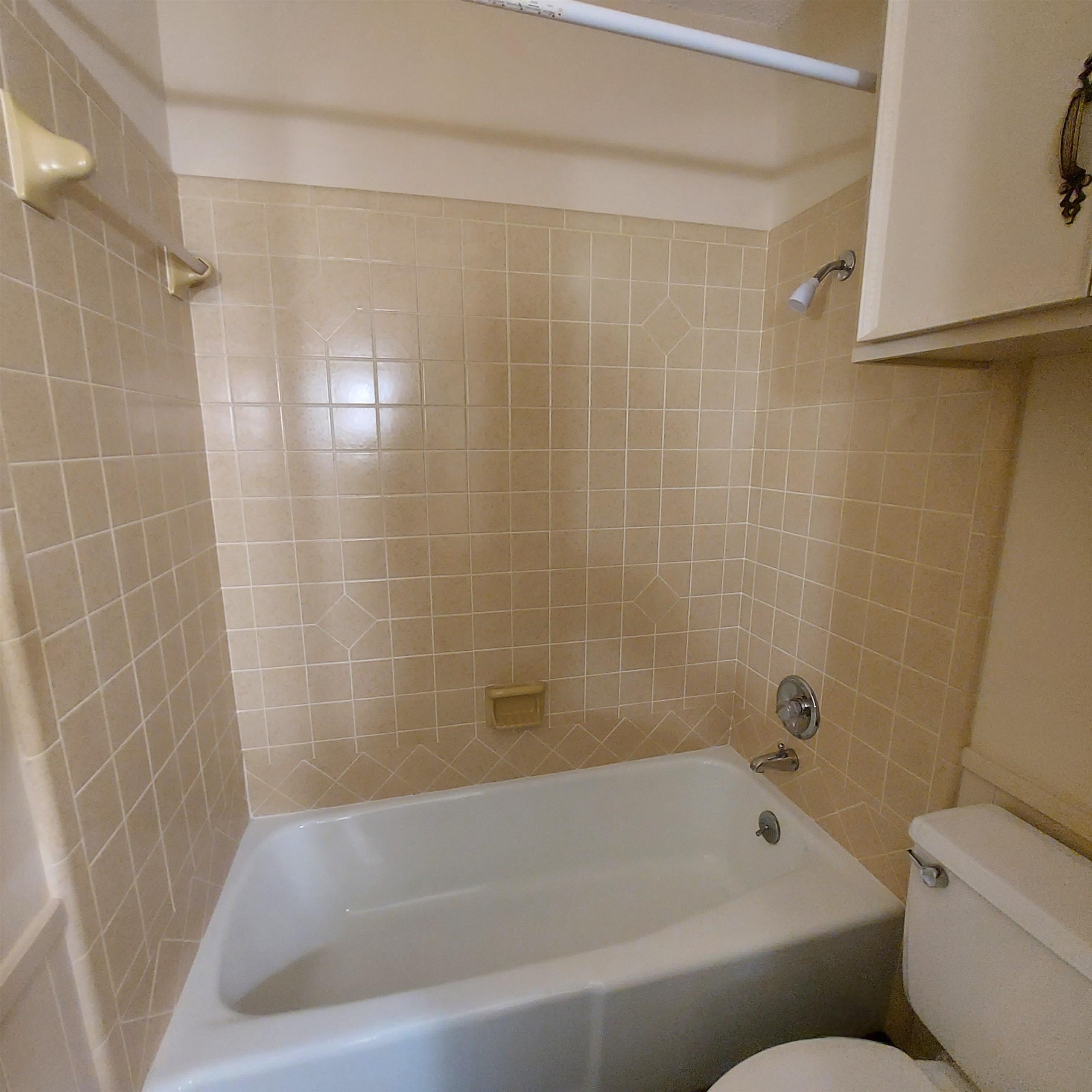 151 Riverside Drive Kingsland, TX 78639 - Photo 9 of 14 a bathroom with a bathtub and a shower
