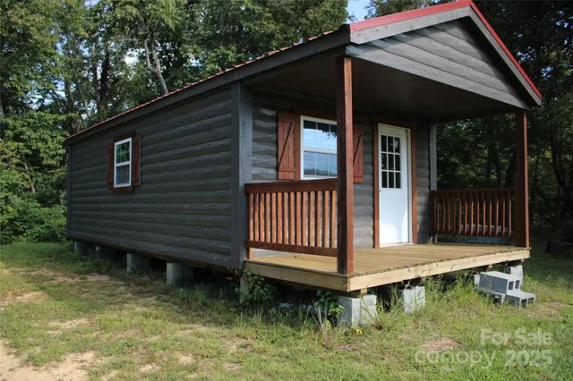 a backyard of a house with a garden and deck