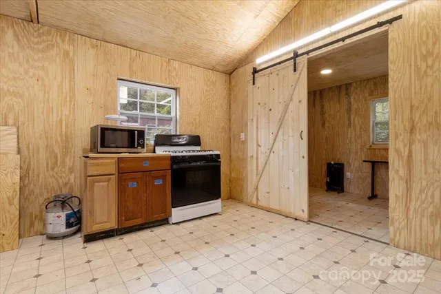 a view of a utility room with closet and windows