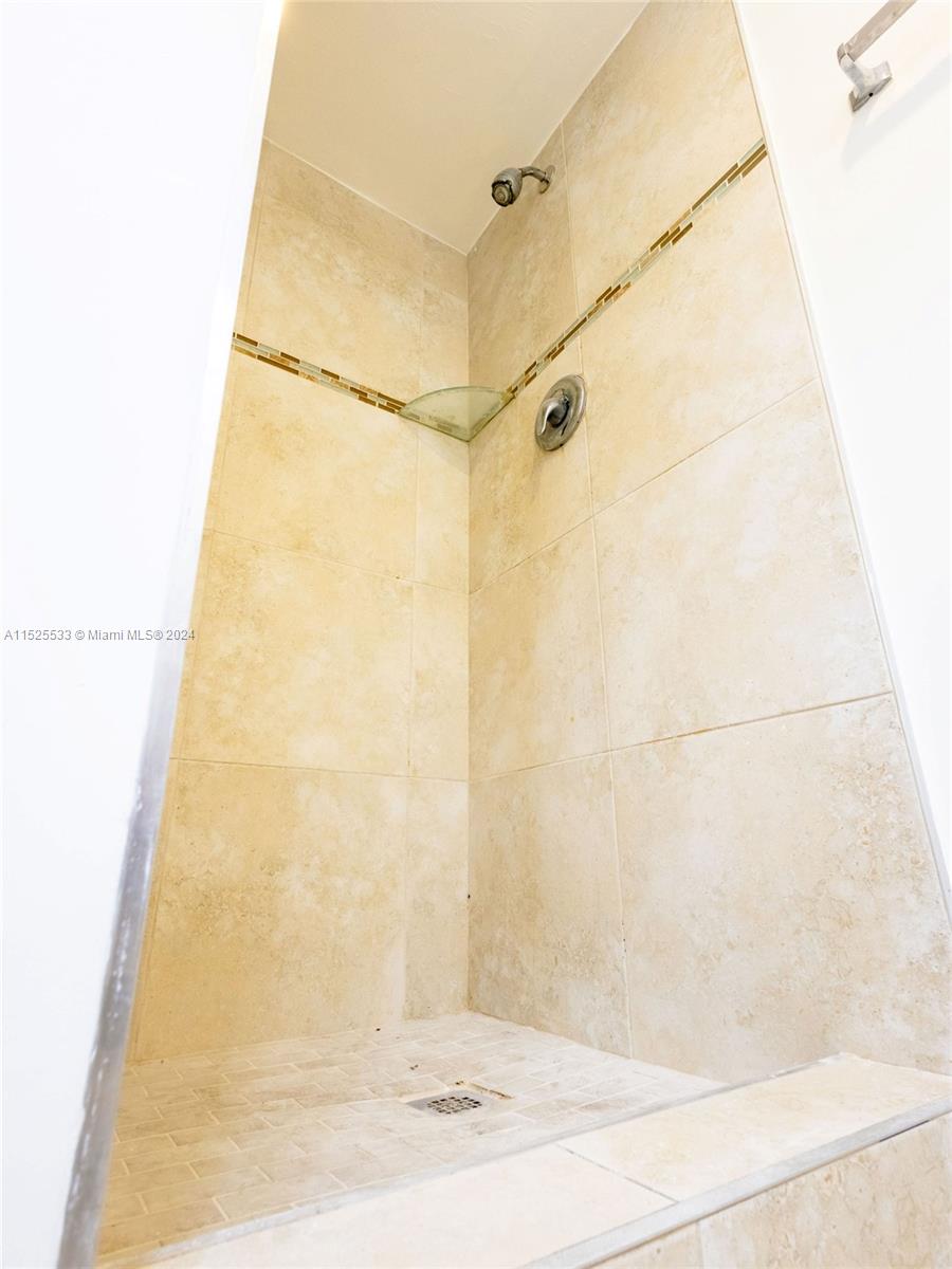 3285 Foxcroft Road, Unit E206 Miramar, FL 33025 - Photo 11 of 35 a bathroom with a shower