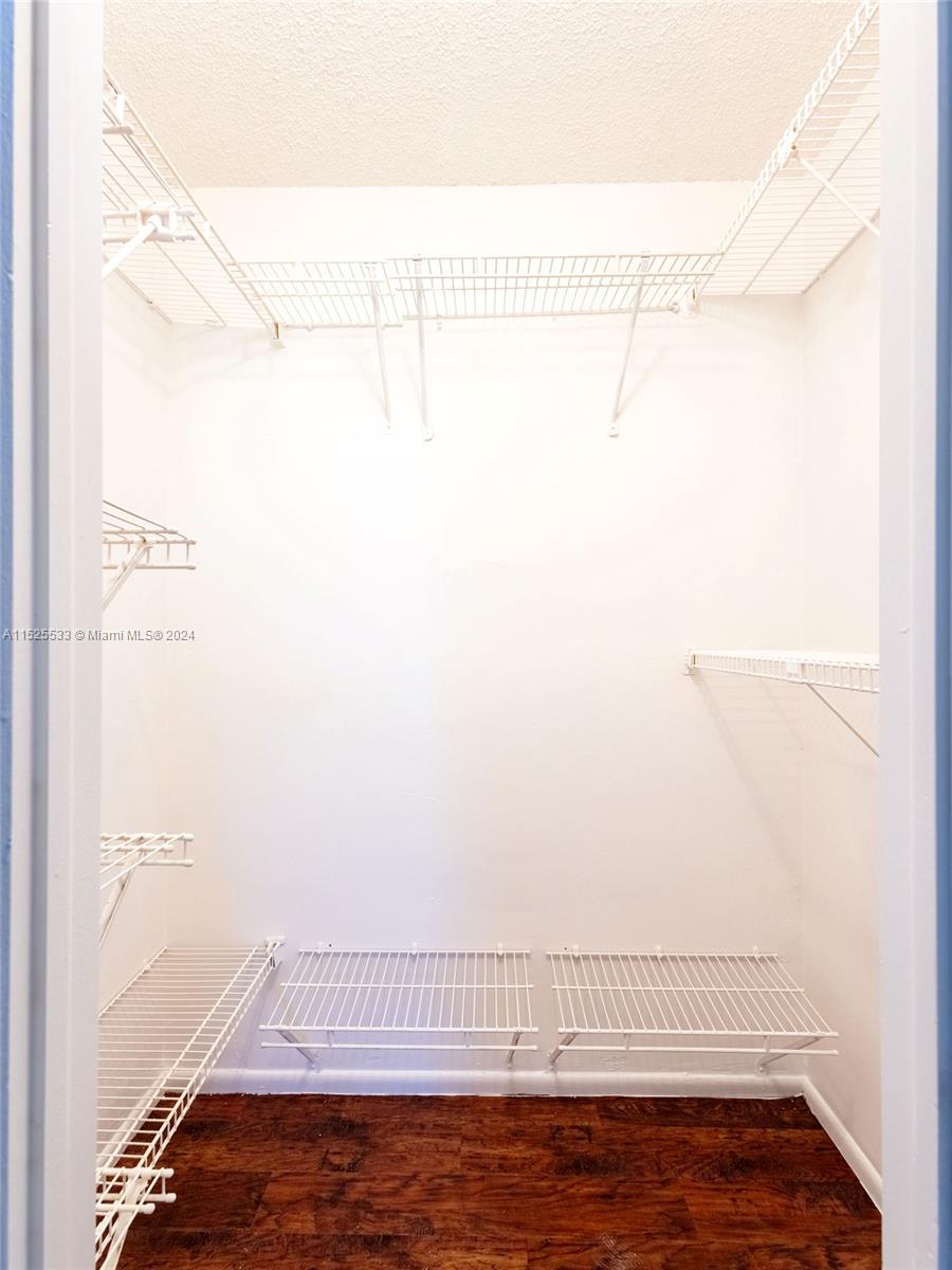 3285 Foxcroft Road, Unit E206 Miramar, FL 33025 - Photo 13 of 35 a view of a room with racks on the wall