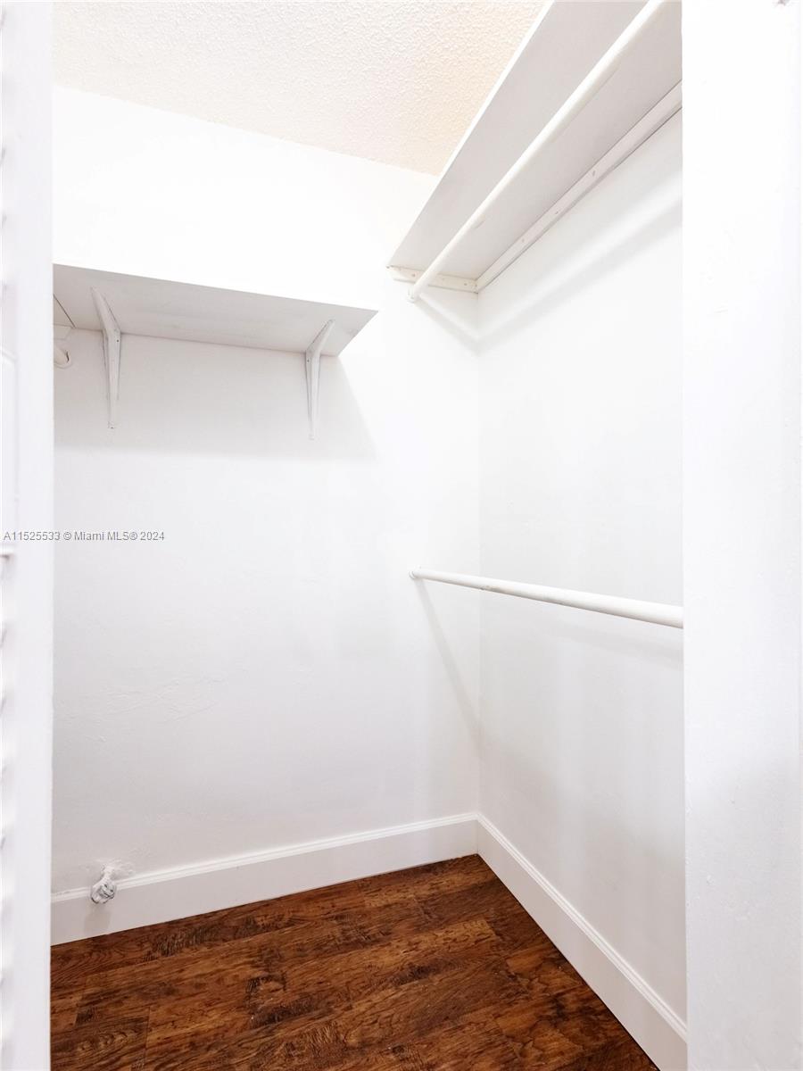 3285 Foxcroft Road, Unit E206 Miramar, FL 33025 - Photo 17 of 35 a view of a room with racks on the wall