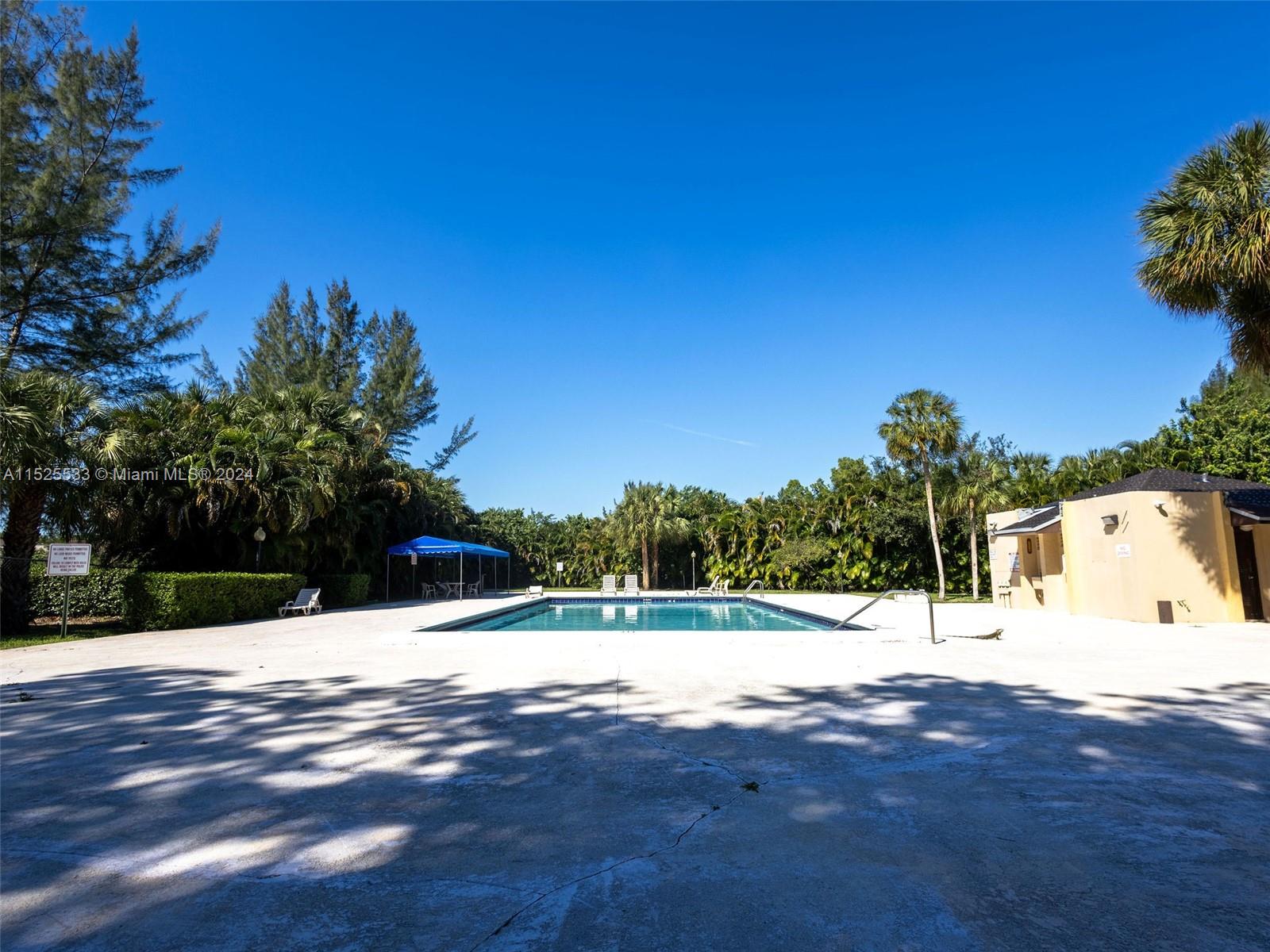 3285 Foxcroft Road, Unit E206 Miramar, FL 33025 - Photo 26 of 35 a view of white house with a yard