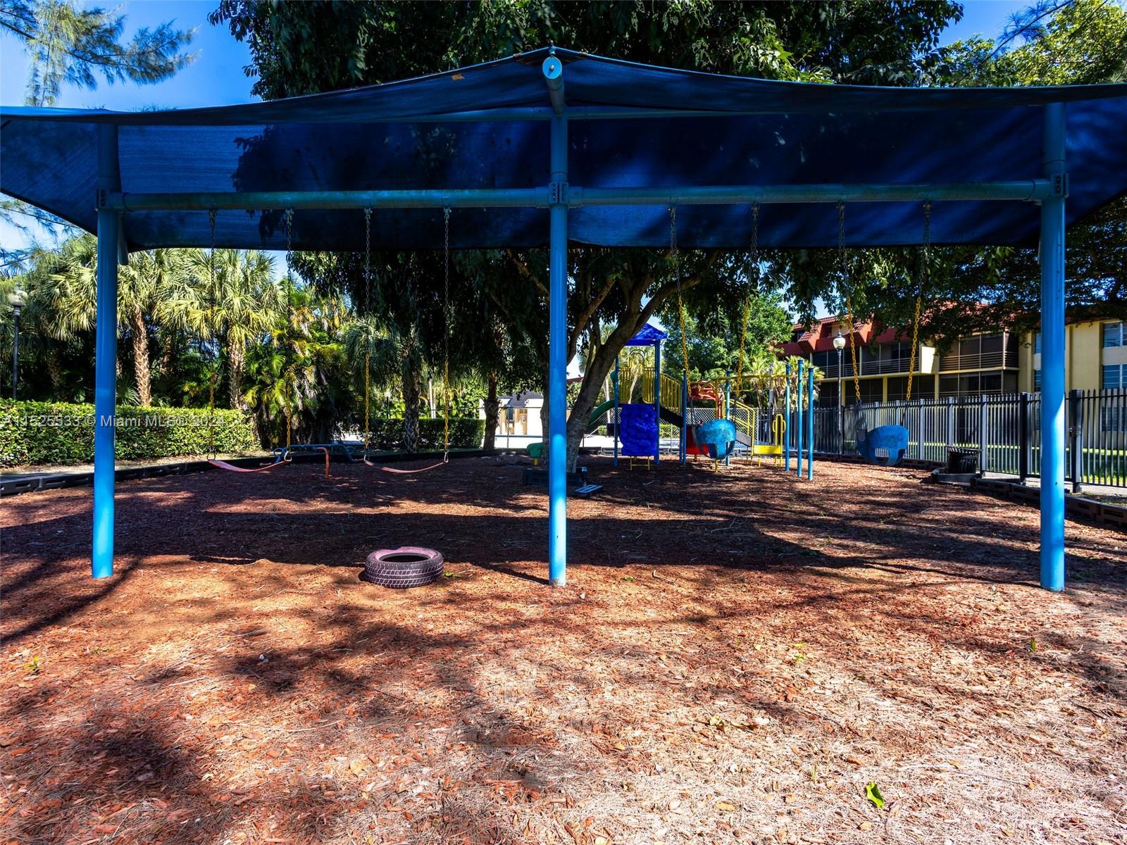 3285 Foxcroft Road, Unit E206 Miramar, FL 33025 - Photo 29 of 35 a view of a street with wooden fence
