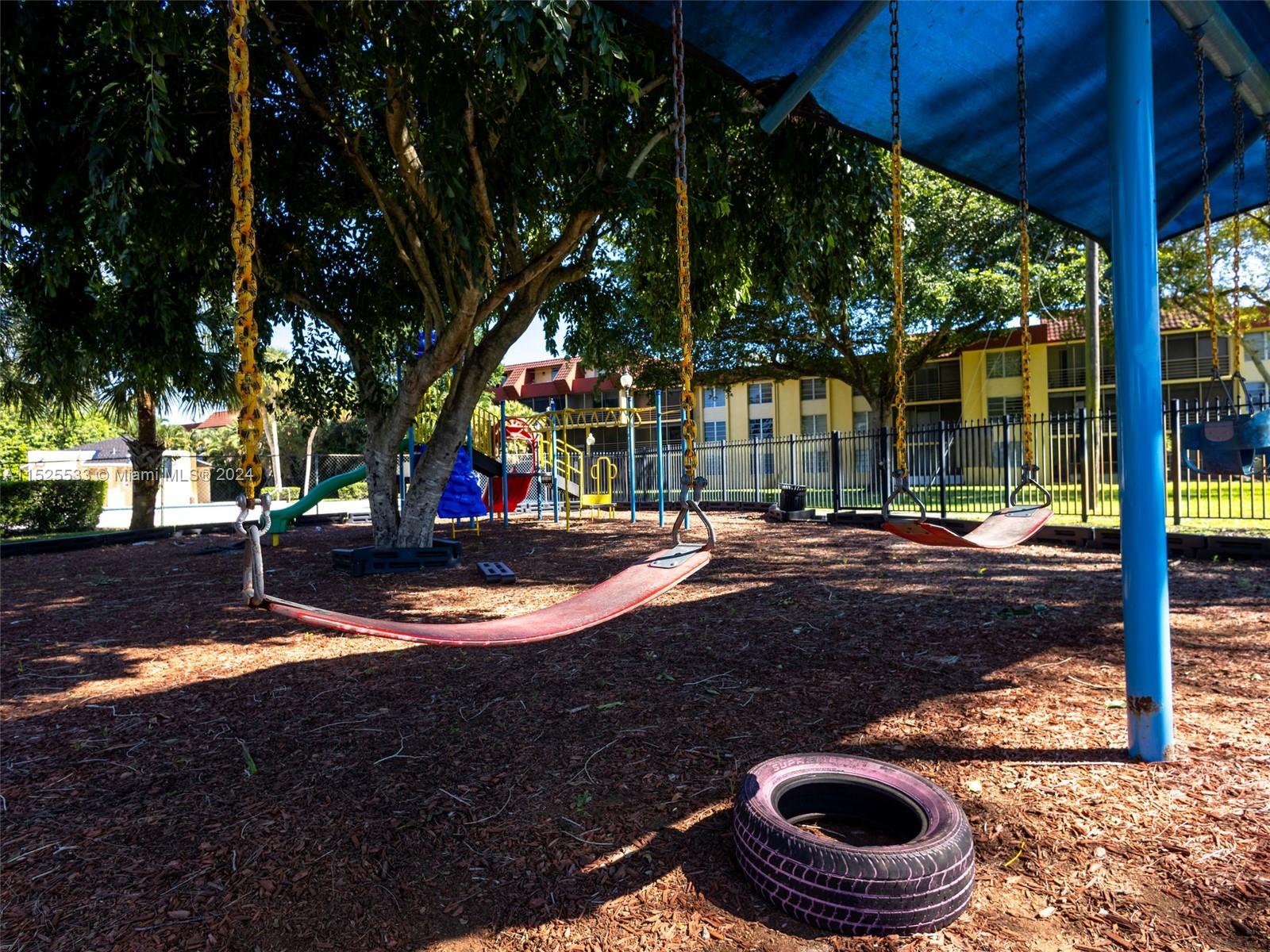 3285 Foxcroft Road, Unit E206 Miramar, FL 33025 - Photo 31 of 35 a view of outdoor space with trees
