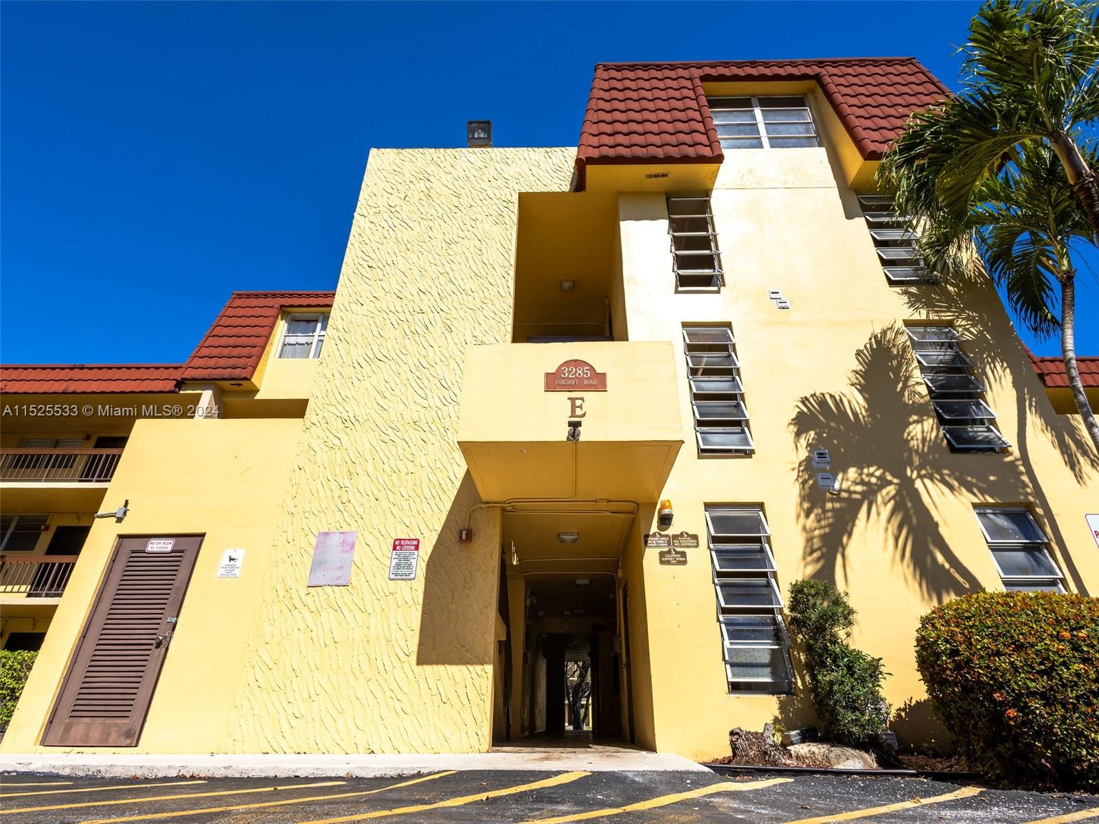 3285 Foxcroft Road, Unit E206 Miramar, FL 33025 - Photo 35 of 35 a front view of a building