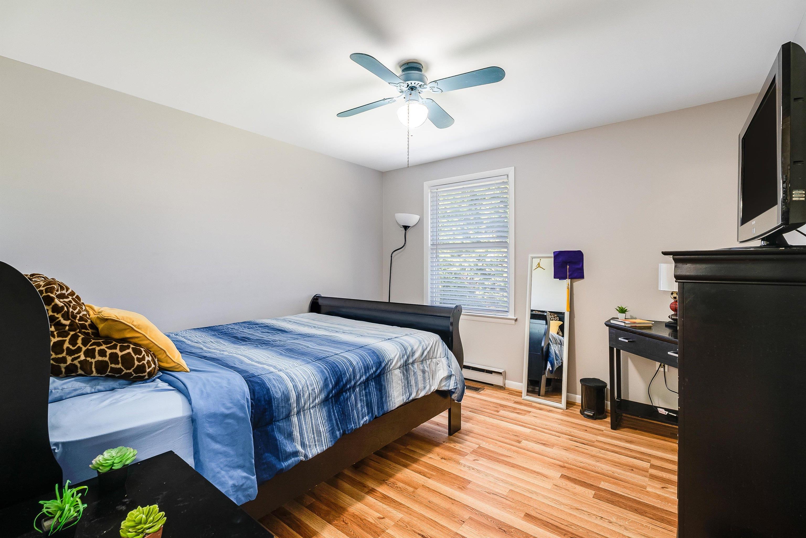 1023 Greendale Road Harrisonburg, VA 22801 - Photo 29 of 53 a bedroom with a bed and a flat screen tv