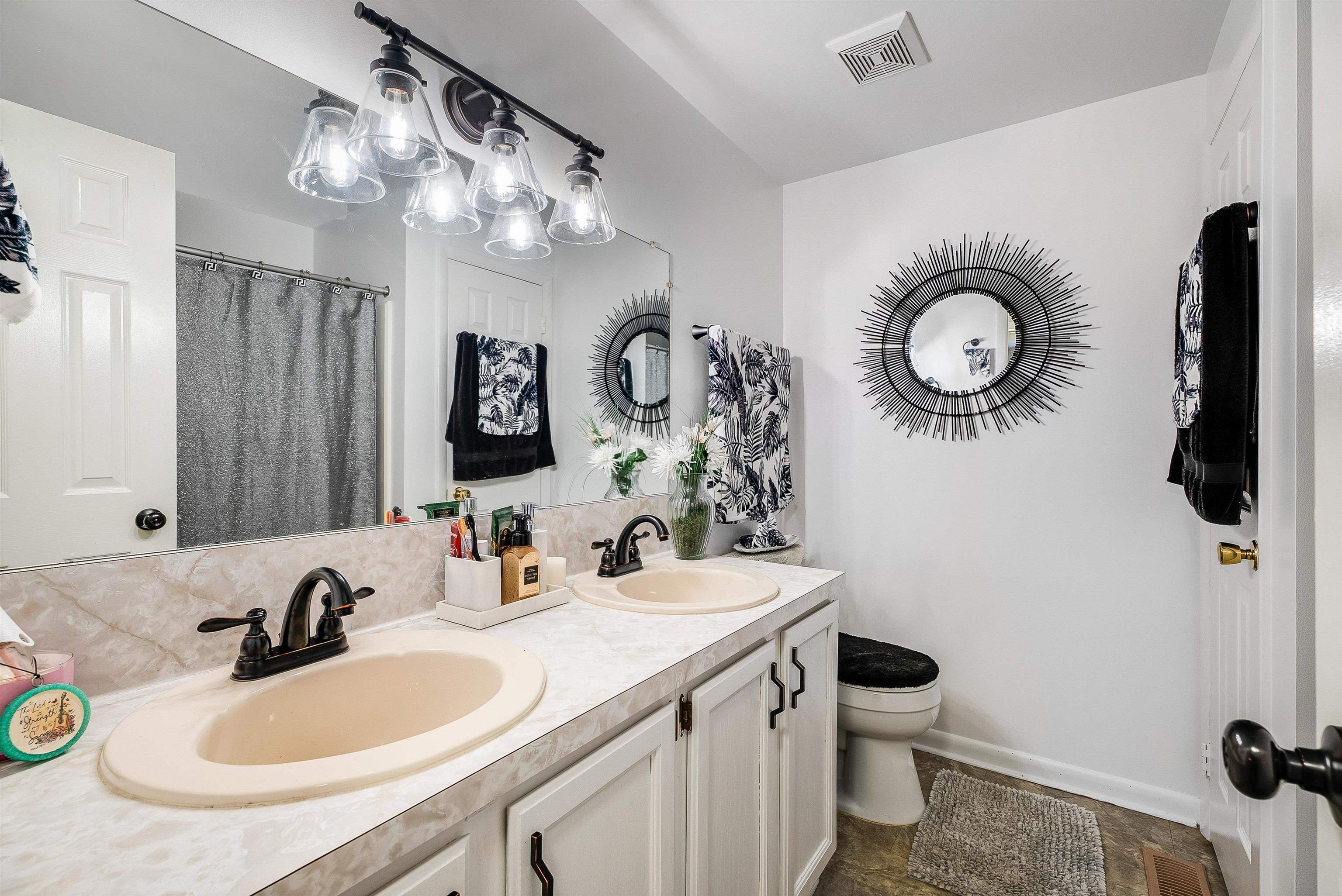 1023 Greendale Road Harrisonburg, VA 22801 - Photo 33 of 53 a bathroom with a sink and a mirror