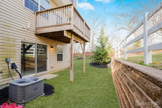 a view of house with backyard and porch