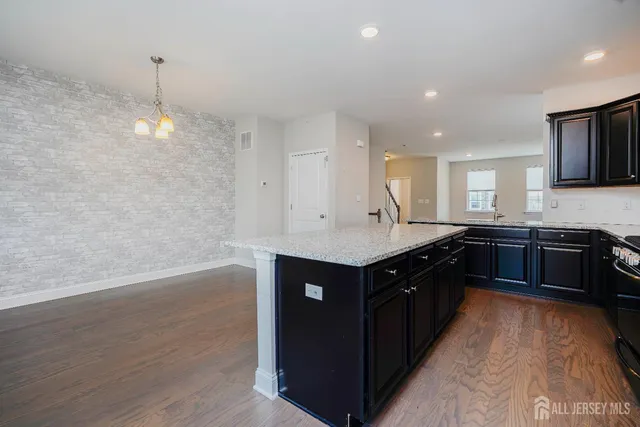 a kitchen with a sink and a stove top oven