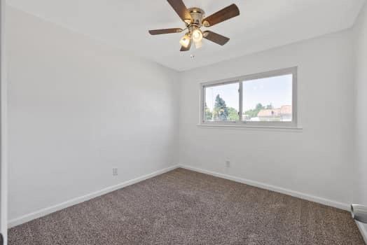2982 D Street Selma, CA 93662 - Photo 11 of 25 an empty room with a window and a fan