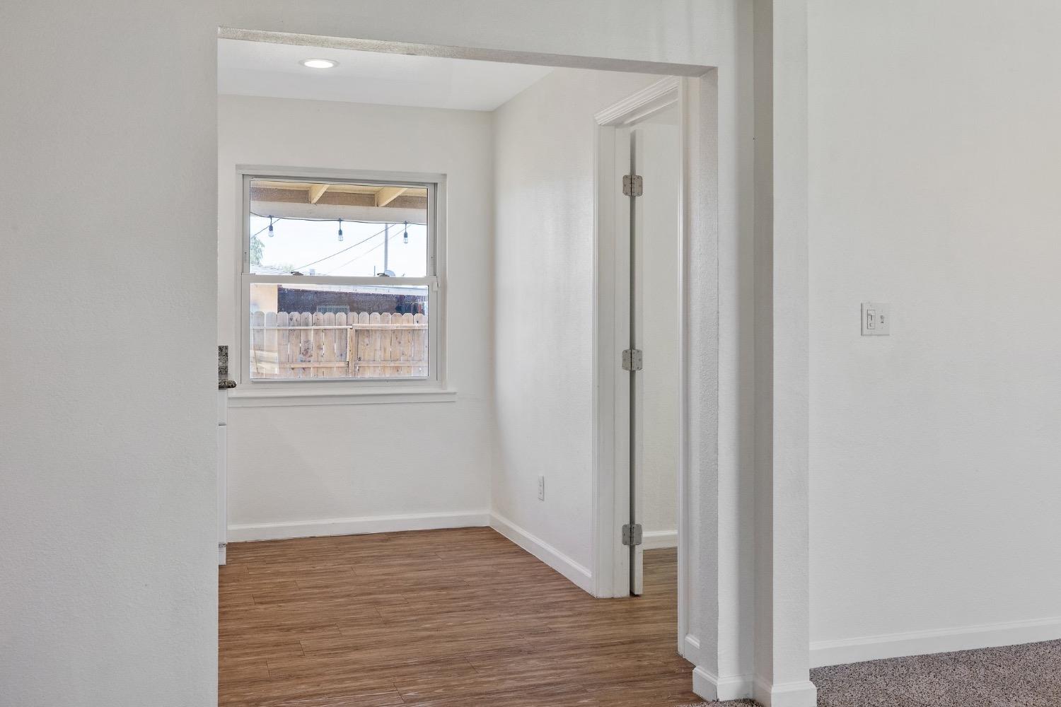2982 D Street Selma, CA 93662 - Photo 14 of 25 a view of an empty room with wooden floor and a window