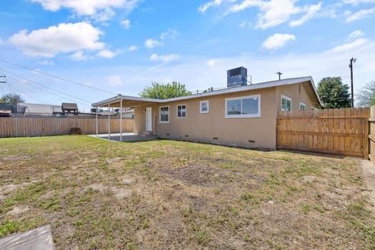 2982 D Street Selma, CA 93662 - Photo 23 of 25 a front view of house with yard and entertaining space