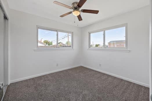 2982 D Street Selma, CA 93662 - Photo 25 of 25 an empty room with a window and a fan