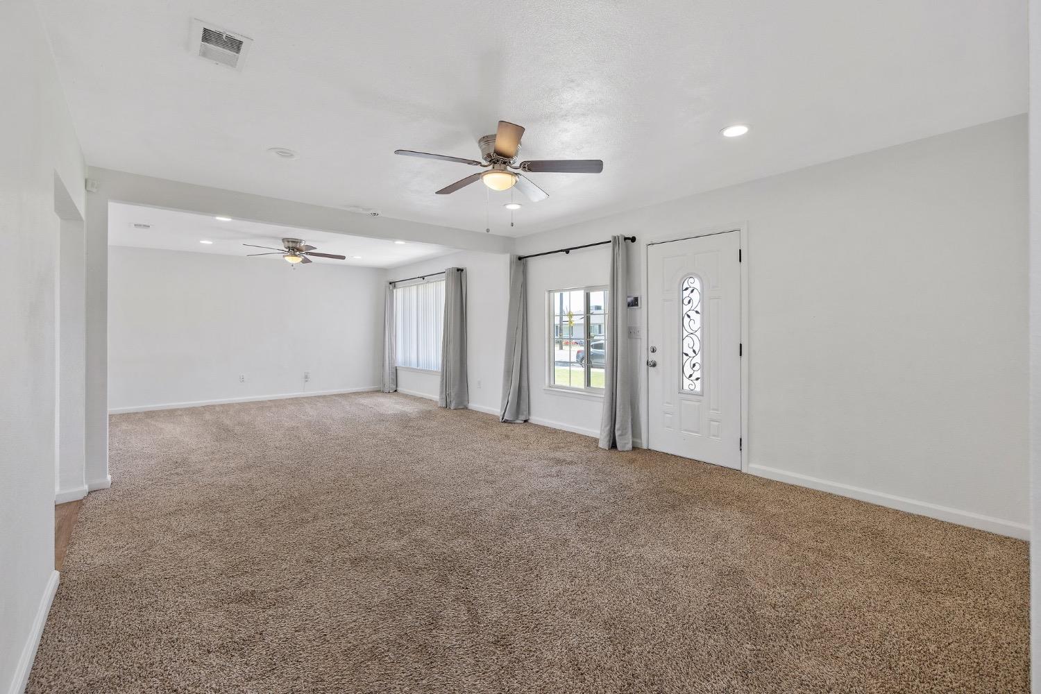 2982 D Street Selma, CA 93662 - Photo 5 of 25 a view of an empty room with a ceiling fan