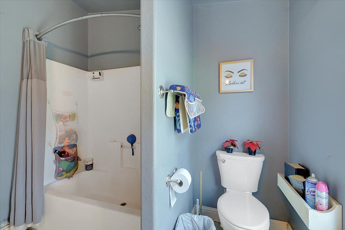 10268 Peoria Road Browns Valley, CA 95918 - Photo 12 of 57 a white toilet sitting next to a bathroom sink and tub
