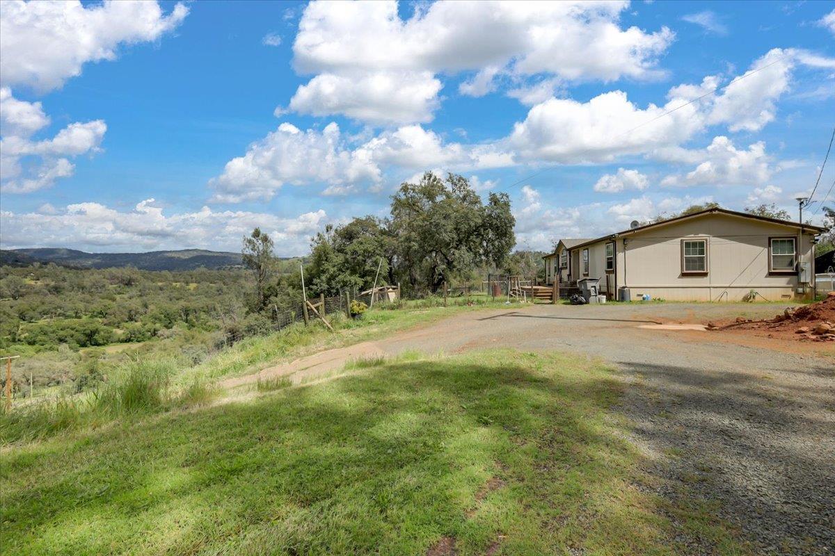 10268 Peoria Road Browns Valley, CA 95918 - Photo 2 of 57 a view of house with yard and car parked