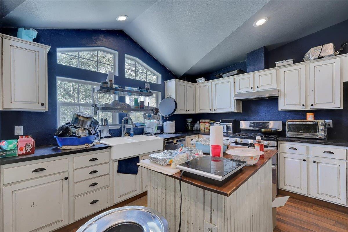 10268 Peoria Road Browns Valley, CA 95918 - Photo 27 of 57 a kitchen with stainless steel appliances granite countertop a sink stove and cabinets