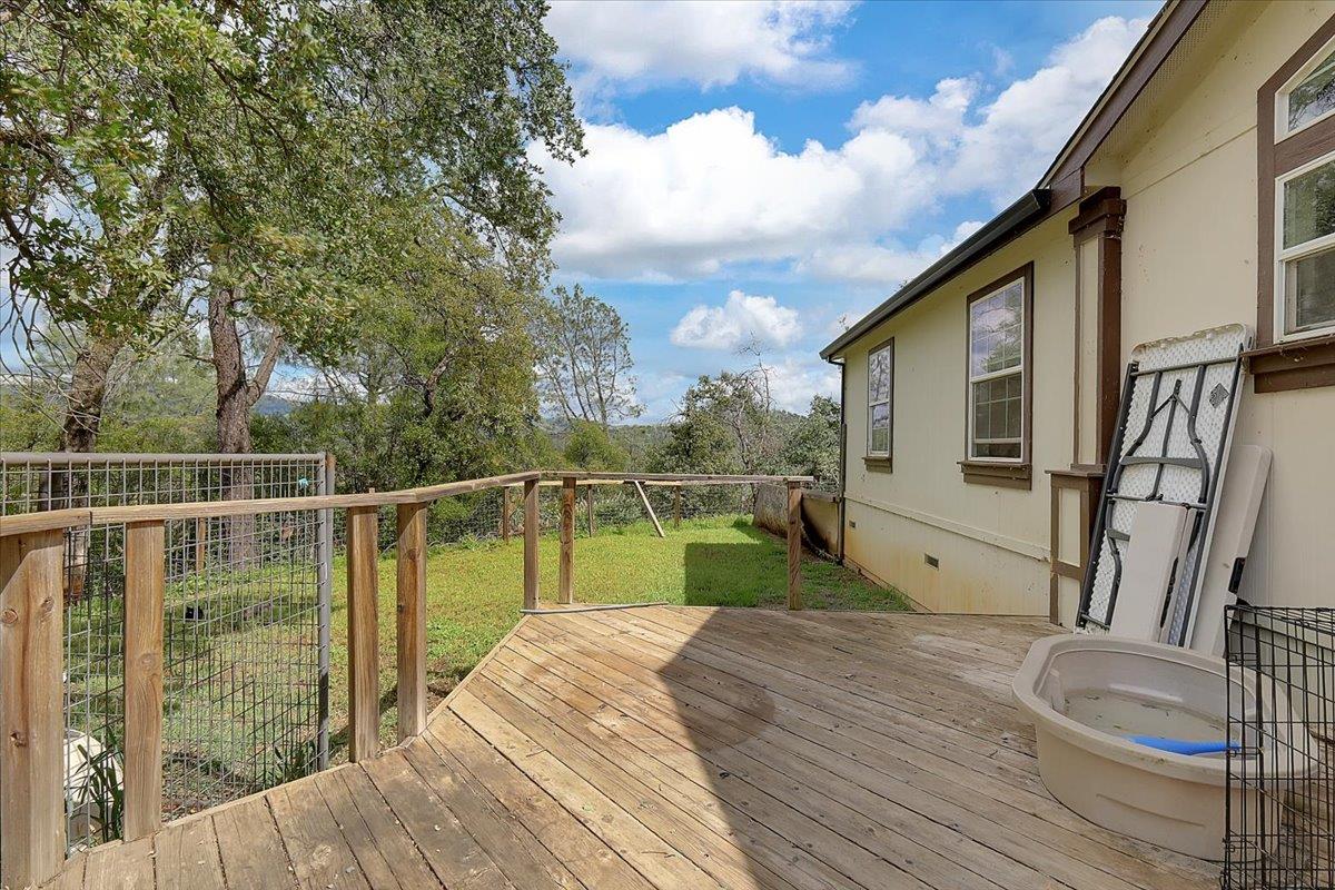 10268 Peoria Road Browns Valley, CA 95918 - Photo 4 of 57 a view of a balcony with chair and wooden floor