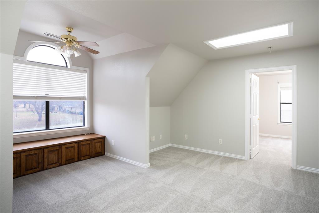 250 Timberleaf Drive Double Oak, TX 75077 - Photo 19 of 23 a view of room with a ceiling fan and a window