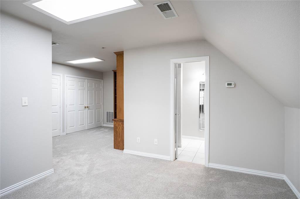250 Timberleaf Drive Double Oak, TX 75077 - Photo 21 of 23 an empty room with a bathroom