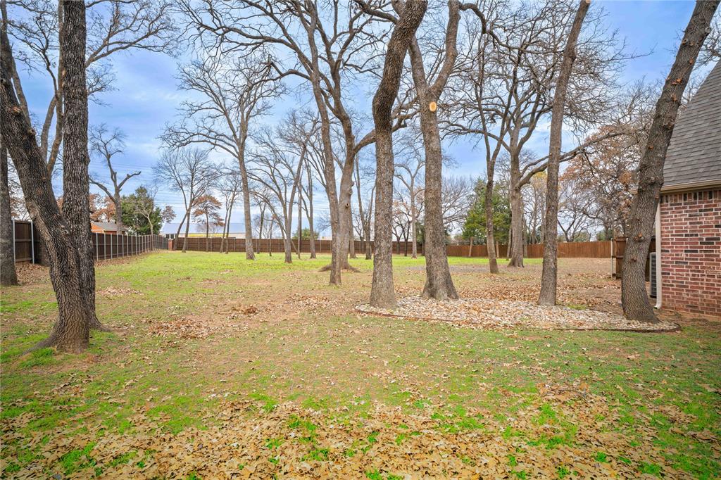250 Timberleaf Drive Double Oak, TX 75077 - Photo 23 of 23 a view of yard with swimming pool