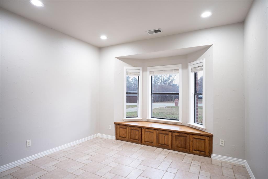 250 Timberleaf Drive Double Oak, TX 75077 - Photo 9 of 23 a spacious bathroom with a tub and a large window